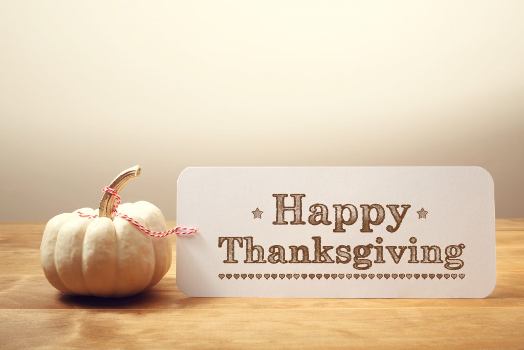 Happy Thanksgiving message with a white pumpkin
